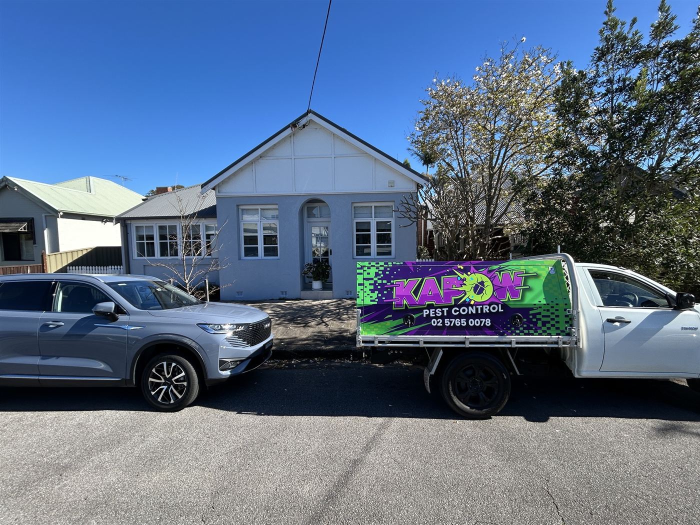 Kapow Pest Control ute on a job outside a weatherboard home in Mayfield, Newcastle